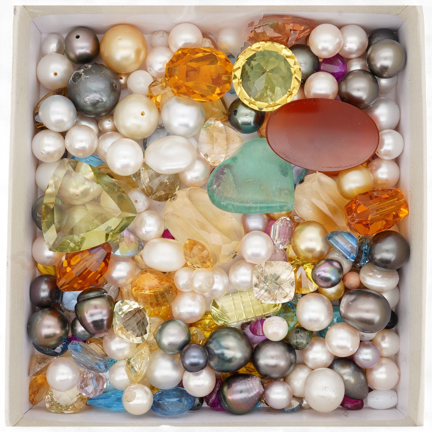 A quantity of assorted loose cultured pearls and unmounted cut gemstones.